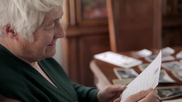 old lady reading a letter